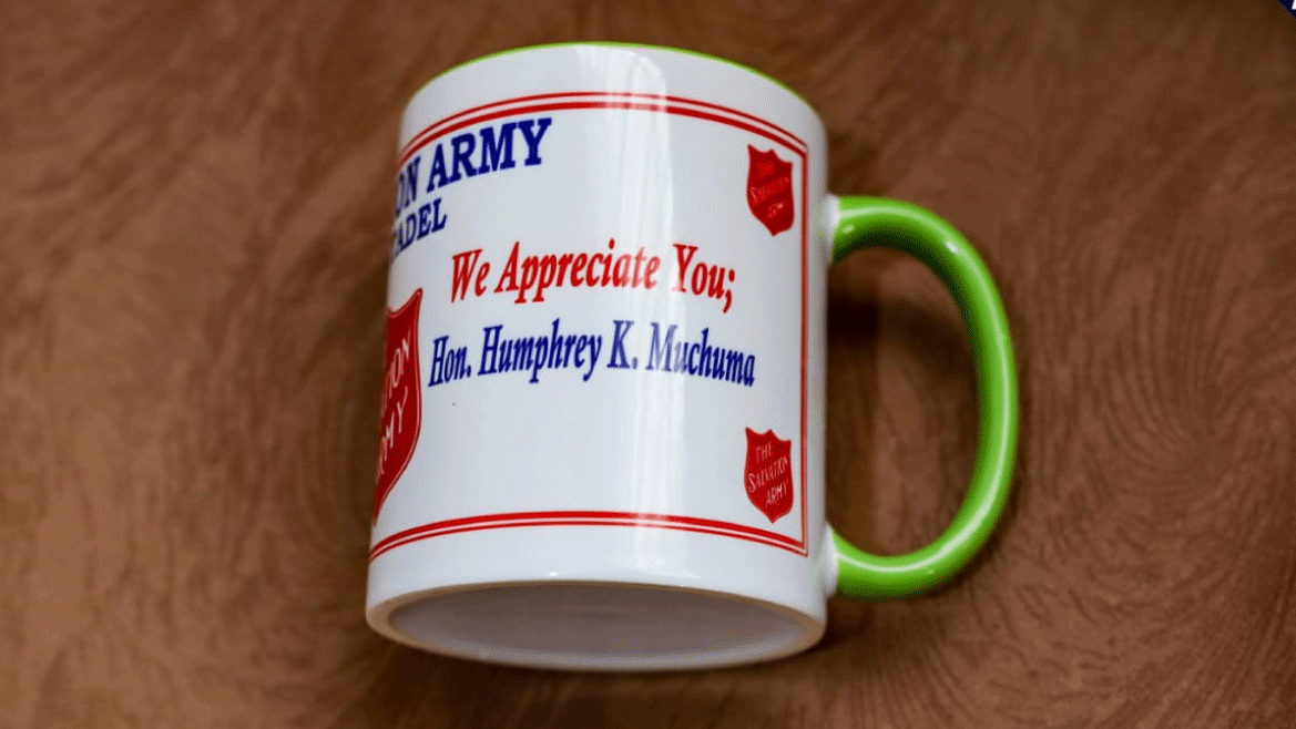 Humphrey-Muchuma-gifted-mugs-at-Salvation-Army-Church-Webuye